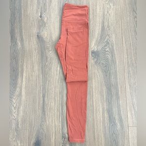 Pink/Salmon colored athlete leggings